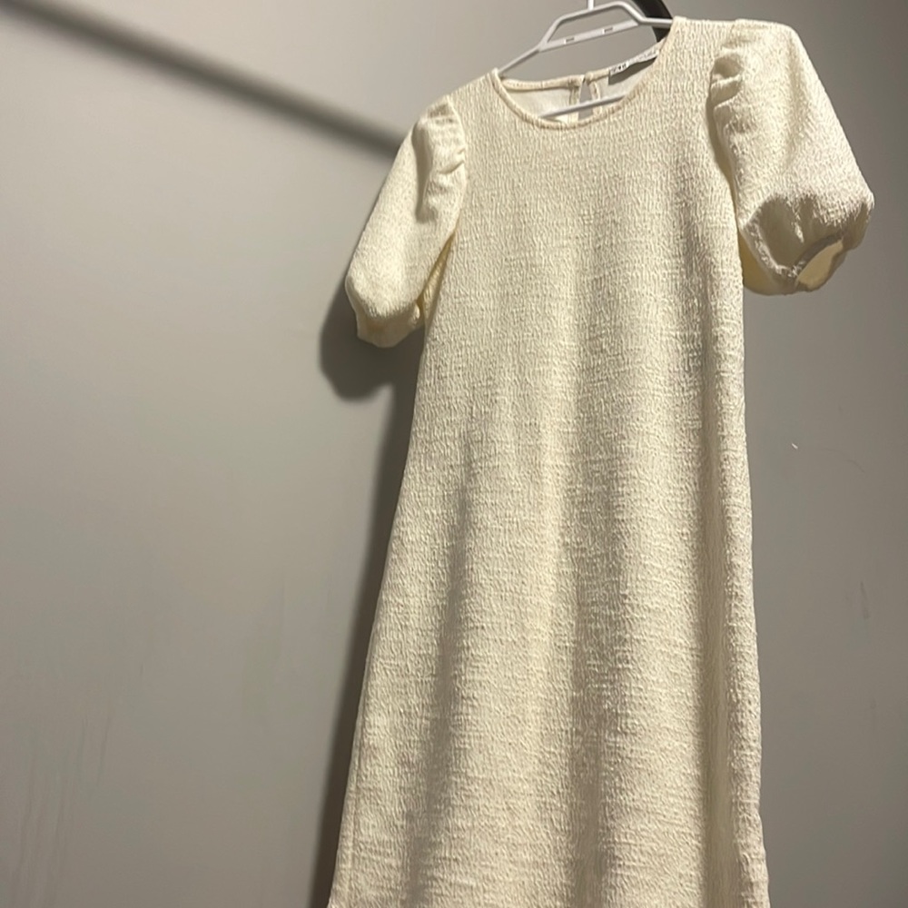 A Creamish White Midi Dress by Zara available in Size S
